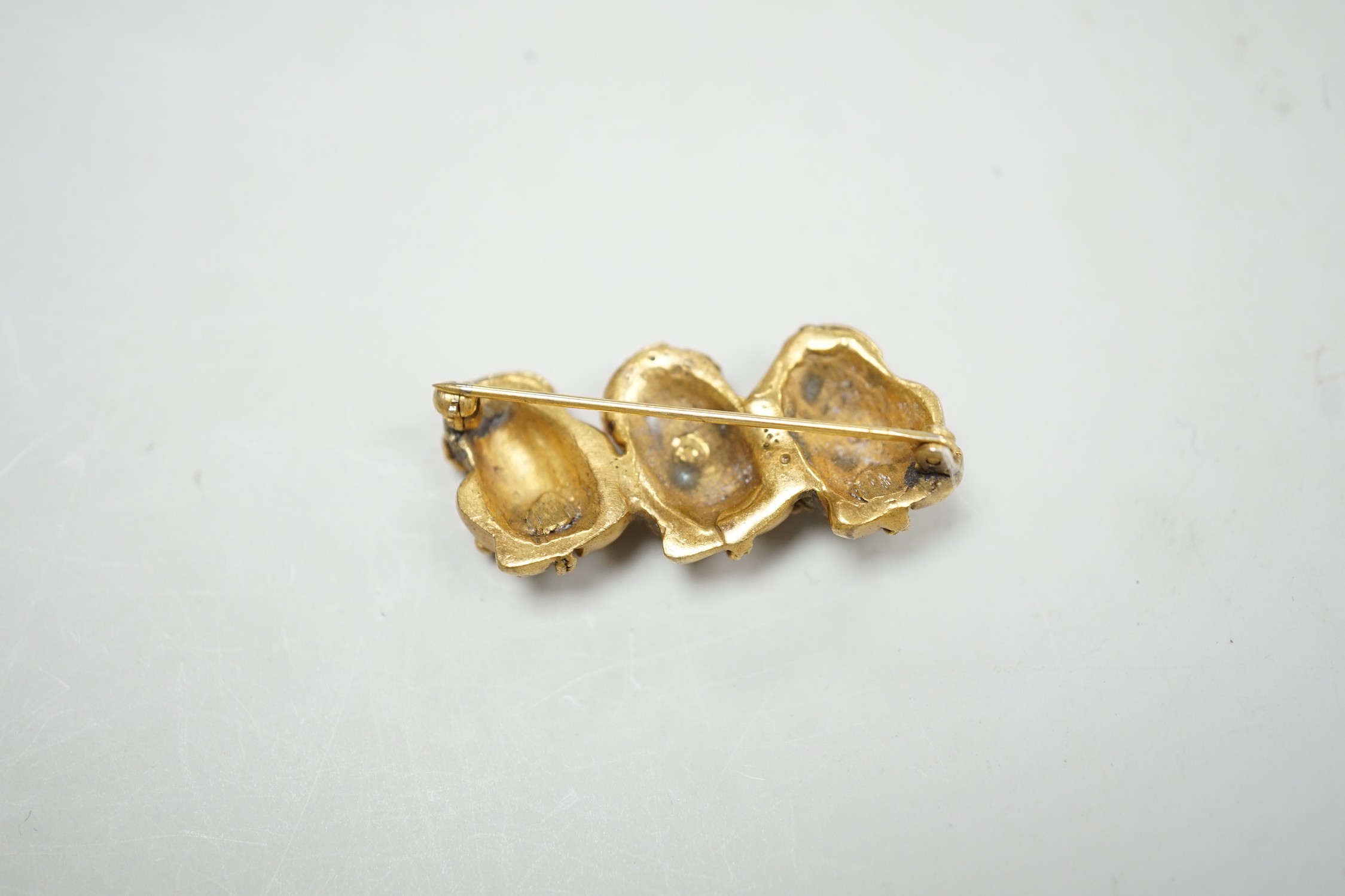 A heavy yellow metal three sectional bar brooch with applied ropework detail, 37mm, 14.5 grams.